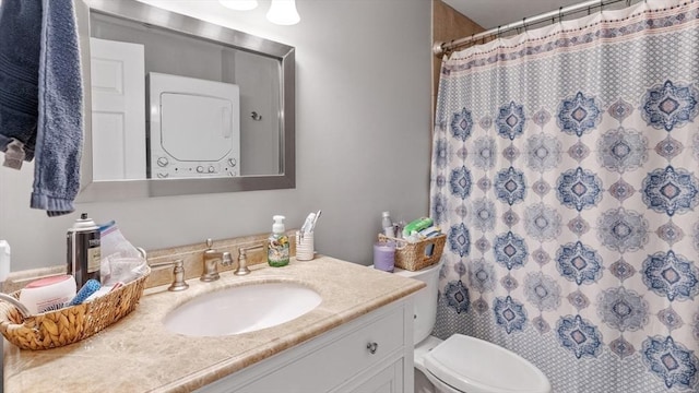 160-162 Rockland St, Fall River, MA 02724 - bathroom featuring estacked washer and dryer, vanity, toilet, and curtained shower