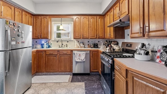 160-162 Rockland St, Fall River, MA 02724 - kitchen featuring appliances with stainless steel finishes, under cabinet range hood, a sink, brown cabinets, and backsplash