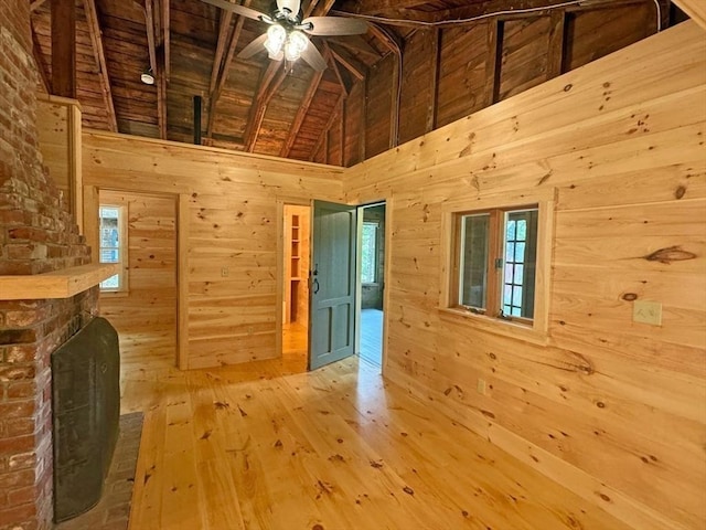 14 Wood Way, Northfield, MA 01360 - unfurnished living room featuring wood walls, wooden ceiling, a ceiling fan, hardwood / wood-style floors, and a fireplace