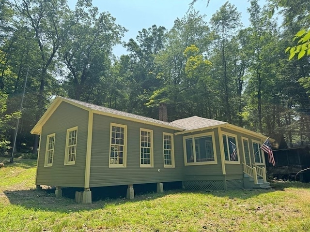 14 Wood Way, Northfield, MA 01360 - view of property exterior with a chimney, a lawn, entry steps, and a shingled roof