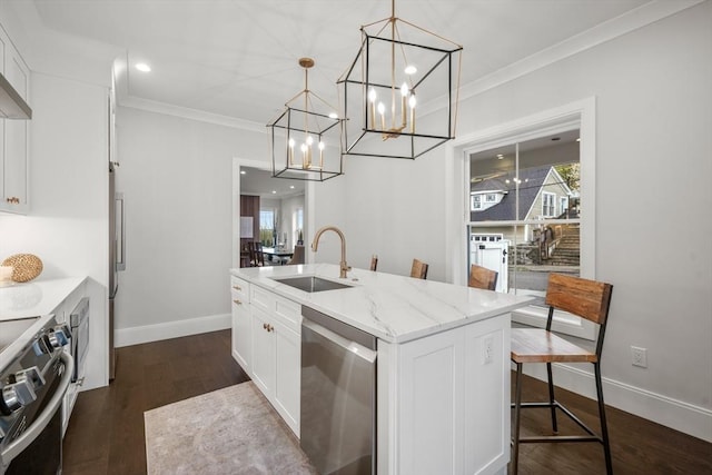 kitchen with appliances with stainless steel finishes, a sink, baseboards, white cabinets, and ornamental molding