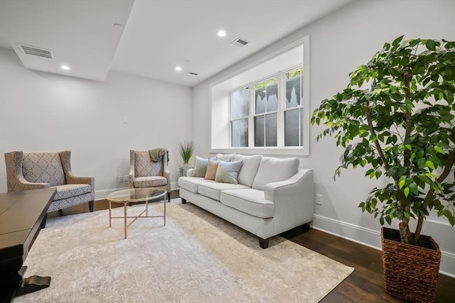 living area featuring baseboards, recessed lighting, dark wood-style floors, and visible vents