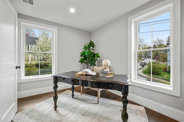 office featuring baseboards, recessed lighting, wood finished floors, and visible vents