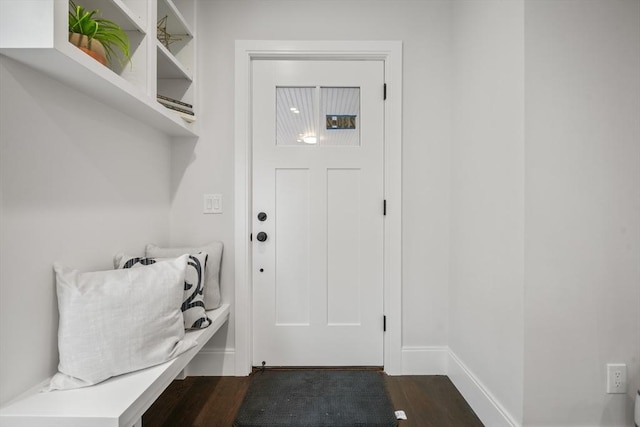 mudroom featuring baseboards and dark wood-style flooring