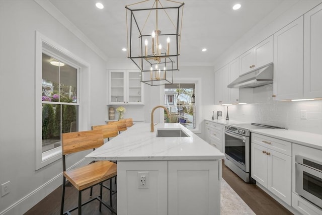 kitchen with stainless steel electric range oven, a sink, a chandelier, white cabinetry, and under cabinet range hood