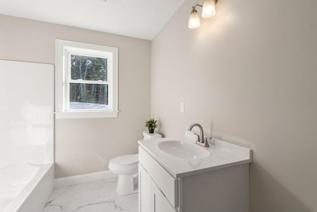 bathroom featuring toilet and vanity