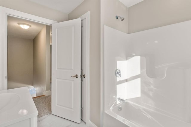 bathroom with vanity and washtub / shower combination