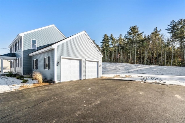 view of property exterior featuring a garage