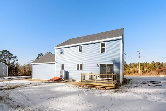 back of house with a deck and ac unit