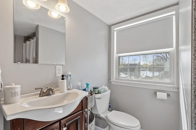 full bath with toilet and vanity