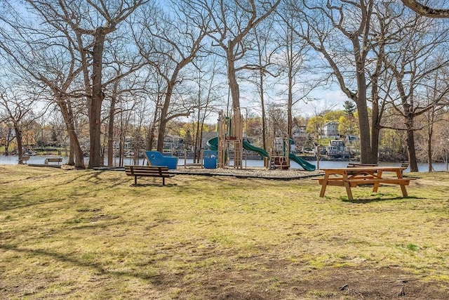 view of community with playground community and a yard
