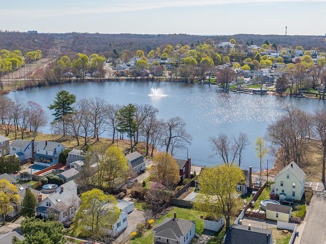 drone / aerial view featuring a water view and a residential view