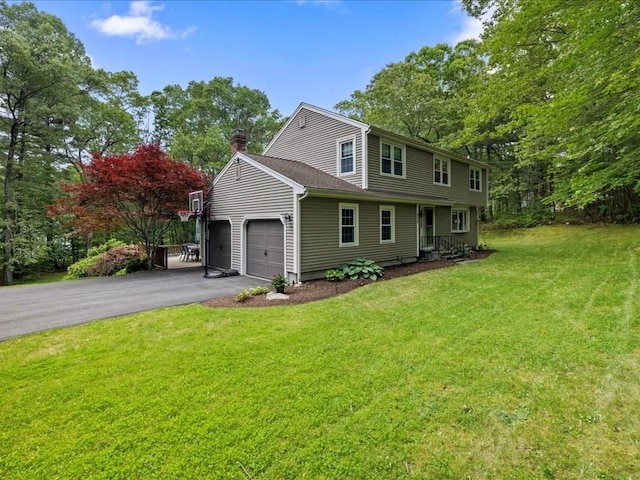 235 Stone School Rd, Sutton, MA 01590 - view of front of home featuring asphalt driveway, a chimney, a front yard, and a garage