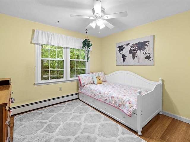 235 Stone School Rd, Sutton, MA 01590 - bedroom with a baseboard heating unit, wood finished floors, baseboards, and ceiling fan