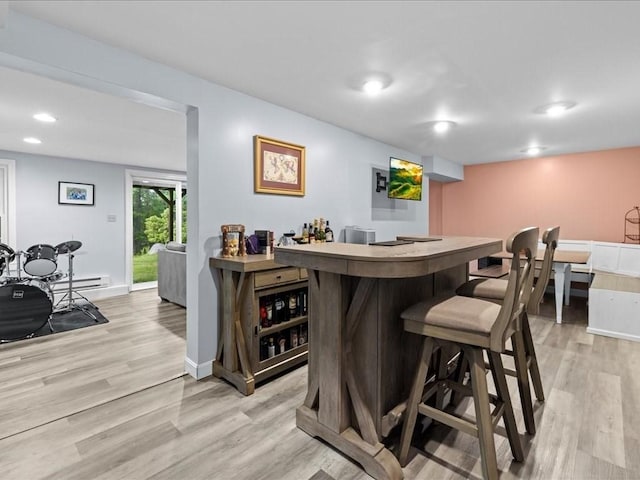 235 Stone School Rd, Sutton, MA 01590 - indoor dry bar featuring light wood-style flooring, recessed lighting, baseboards, and a baseboard radiator