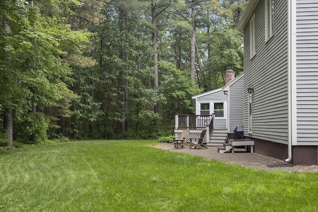 24 Fairhaven Cir, Sudbury, MA 01776 - view of grassy yard featuring a patio area and a wooden deck