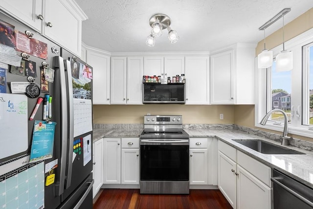 453 Turnpike St Unit 19, Easton, MA 02375 - kitchen with stainless steel appliances, white cabinets, light stone countertops, dark wood-style flooring, and pendant lighting