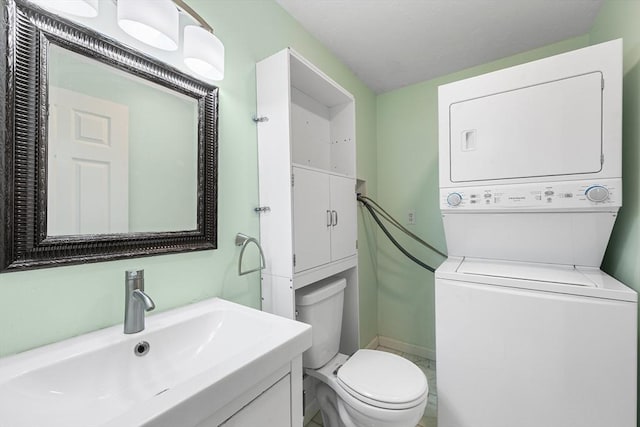 453 Turnpike St Unit 19, Easton, MA 02375 - half bathroom with stacked washing machine and dryer and vanity