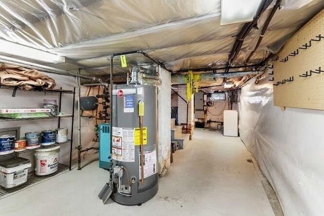 unfinished below grade area featuring water heater and electric panel