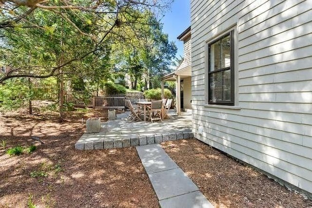 view of yard with a patio and fence