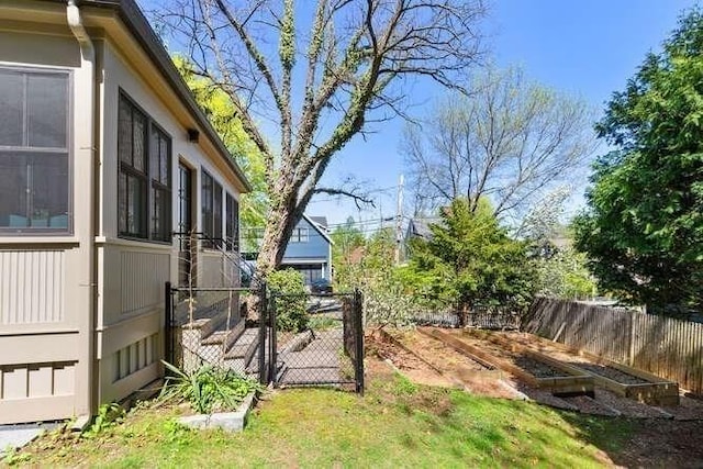 view of yard featuring a gate and fence