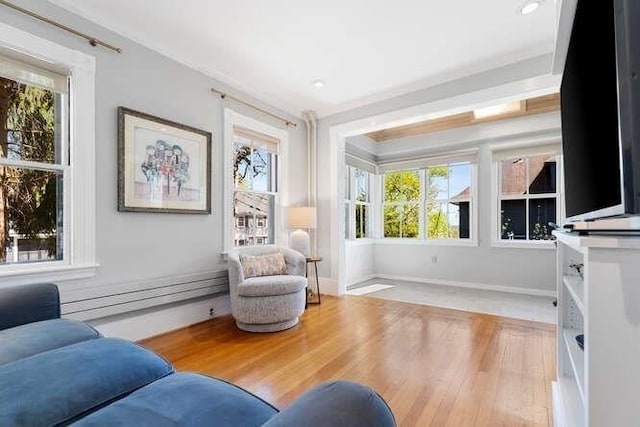 sitting room featuring recessed lighting, baseboards, and wood finished floors