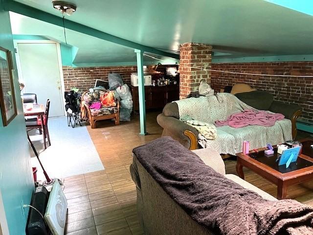 40 Byers St, Springfield, MA 01105 - living area featuring brick wall and tile patterned floors