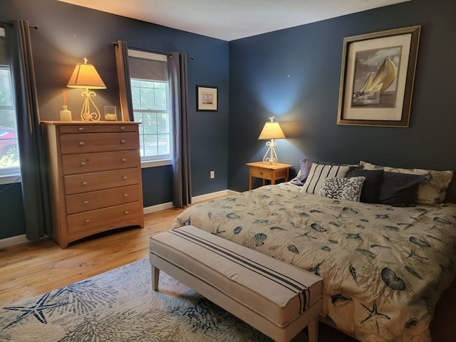 bedroom with light hardwood / wood-style floors