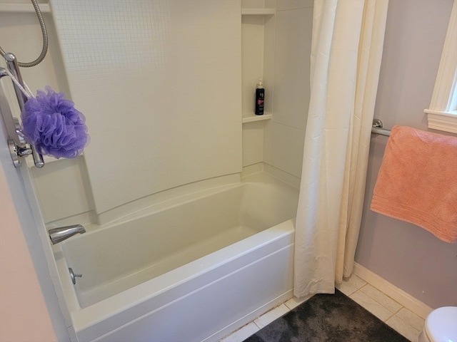 bathroom with shower / tub combo and tile patterned flooring