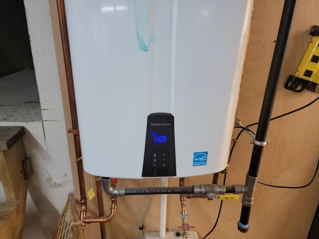 utility room featuring water heater