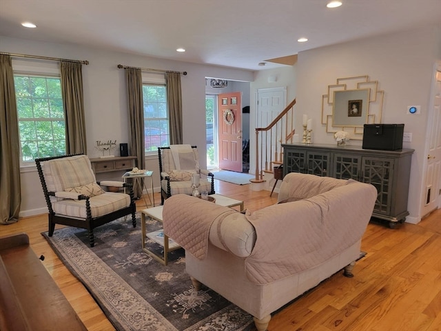 living room with light hardwood / wood-style floors and plenty of natural light