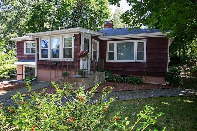 view of front of property with a chimney