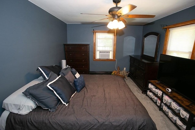 bedroom featuring cooling unit, carpet, and ceiling fan