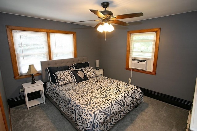 bedroom with dark colored carpet, a ceiling fan, and cooling unit