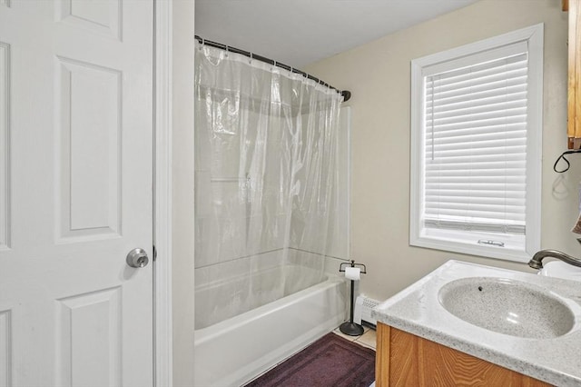 bathroom featuring vanity and shower / tub combo with curtain