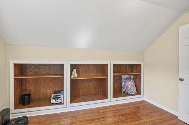 room details with baseboards and wood finished floors
