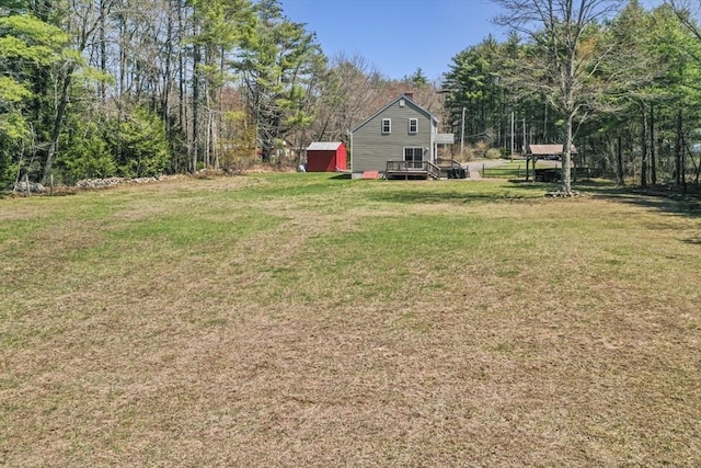 view of yard featuring a wooden deck