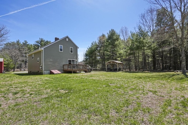 view of yard featuring a deck and a gazebo