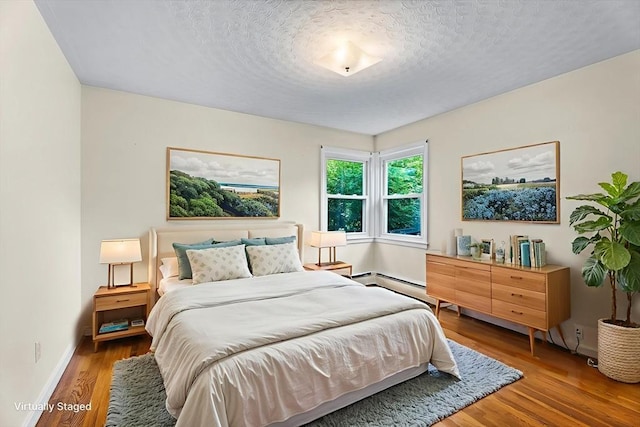 18 Fairview Rd, Westborough, MA 01581 - bedroom with wood finished floors and a textured ceiling