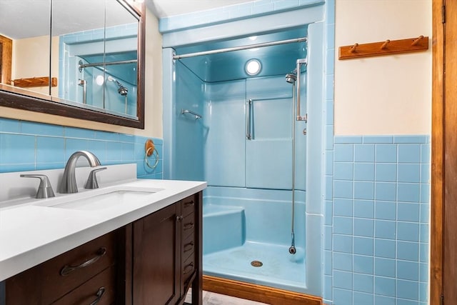 18 Fairview Rd, Westborough, MA 01581 - full bathroom featuring a shower stall, tile walls, vanity, and a wainscoted wall