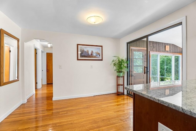 18 Fairview Rd, Westborough, MA 01581 - unfurnished dining area with light wood-type flooring and arched walkways