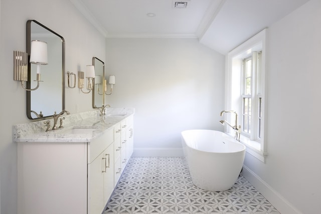 bathroom with vanity, a tub to relax in, crown molding, and a wealth of natural light