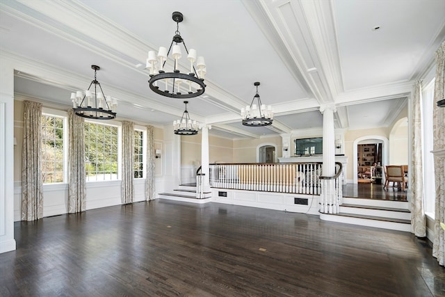 interior space with coffered ceiling, dark hardwood / wood-style floors, a notable chandelier, ornamental molding, and beamed ceiling