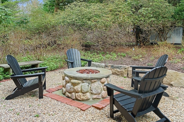 view of yard with a fire pit and a patio