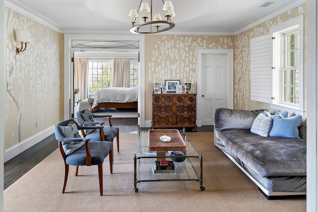 living room featuring dark wood-type flooring, a chandelier, and crown molding