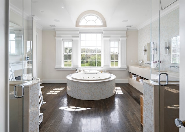 bathroom with hardwood / wood-style flooring, plenty of natural light, and separate shower and tub