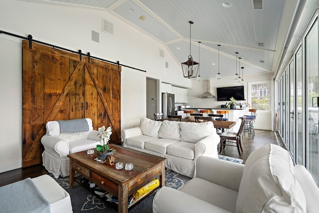 living room with a barn door, high vaulted ceiling, wood ceiling, and wood-type flooring