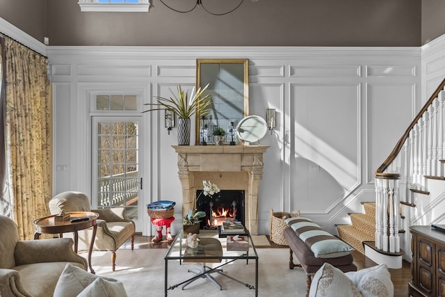 living room featuring a fireplace and wood-type flooring