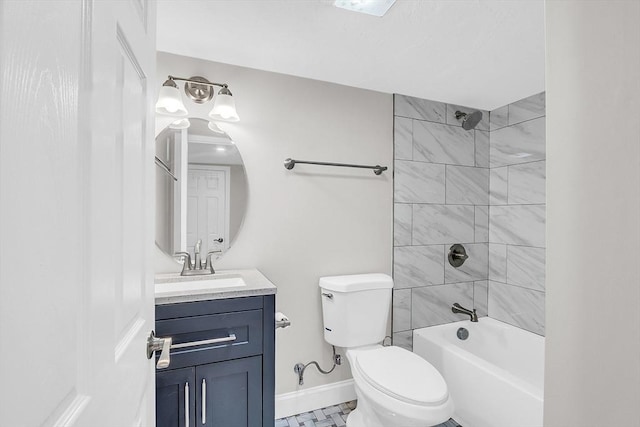 full bathroom featuring vanity, tile patterned floors, tiled shower / bath combo, and toilet