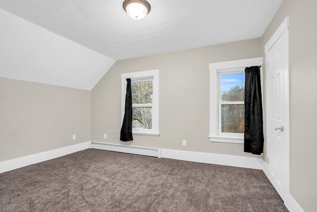 bonus room with carpet floors, a healthy amount of sunlight, vaulted ceiling, and a baseboard heating unit